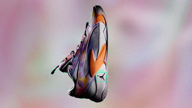 Side view of Luka Doncic's purple and orange Jordan Brand shoes.